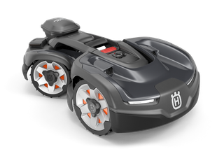 Side view of a Husqvarna robotic lawn mower with distinct wheel design.